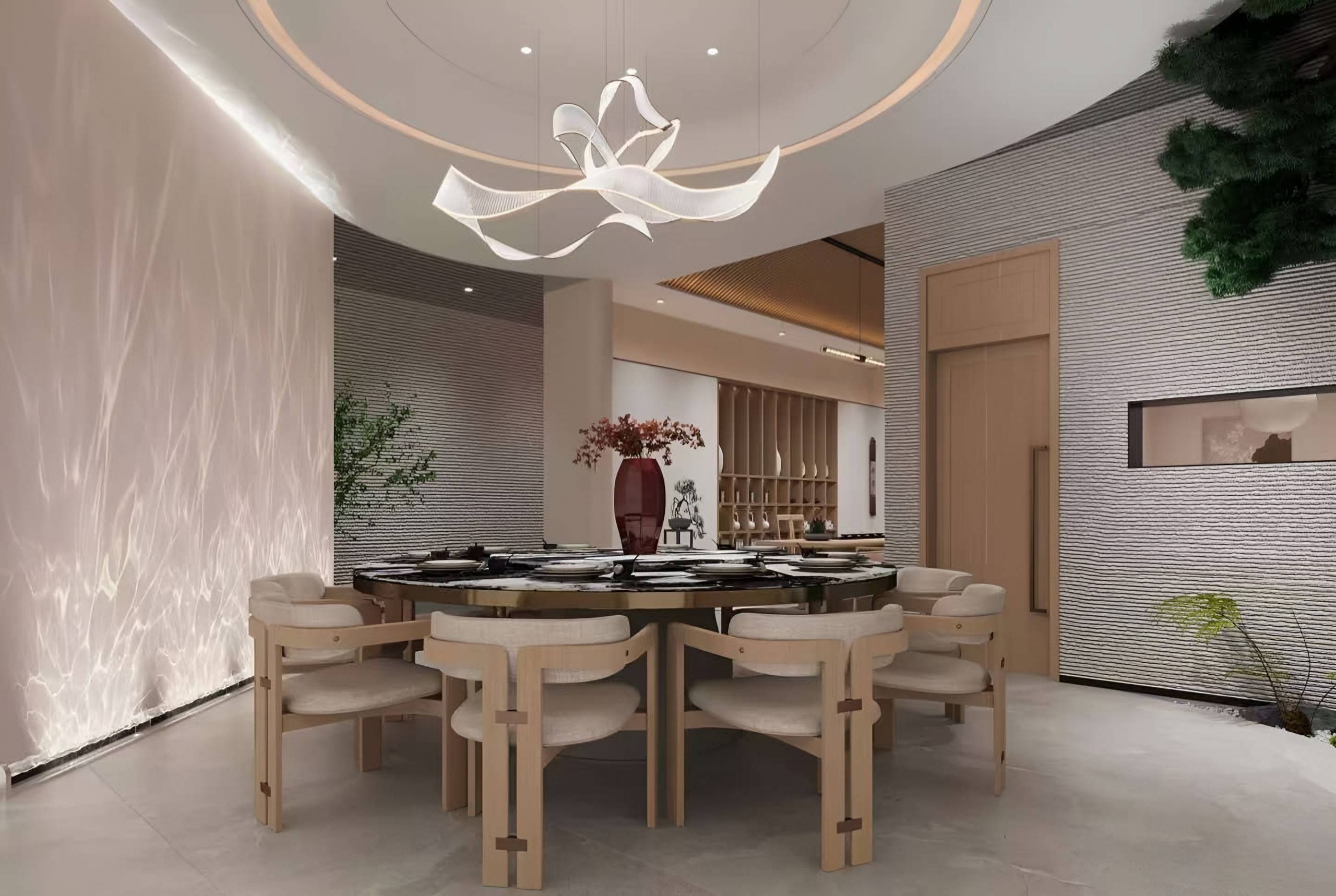 Private dining room with a ribbon-form chandelier, a round stone table, timber chairs and textured plaster walls