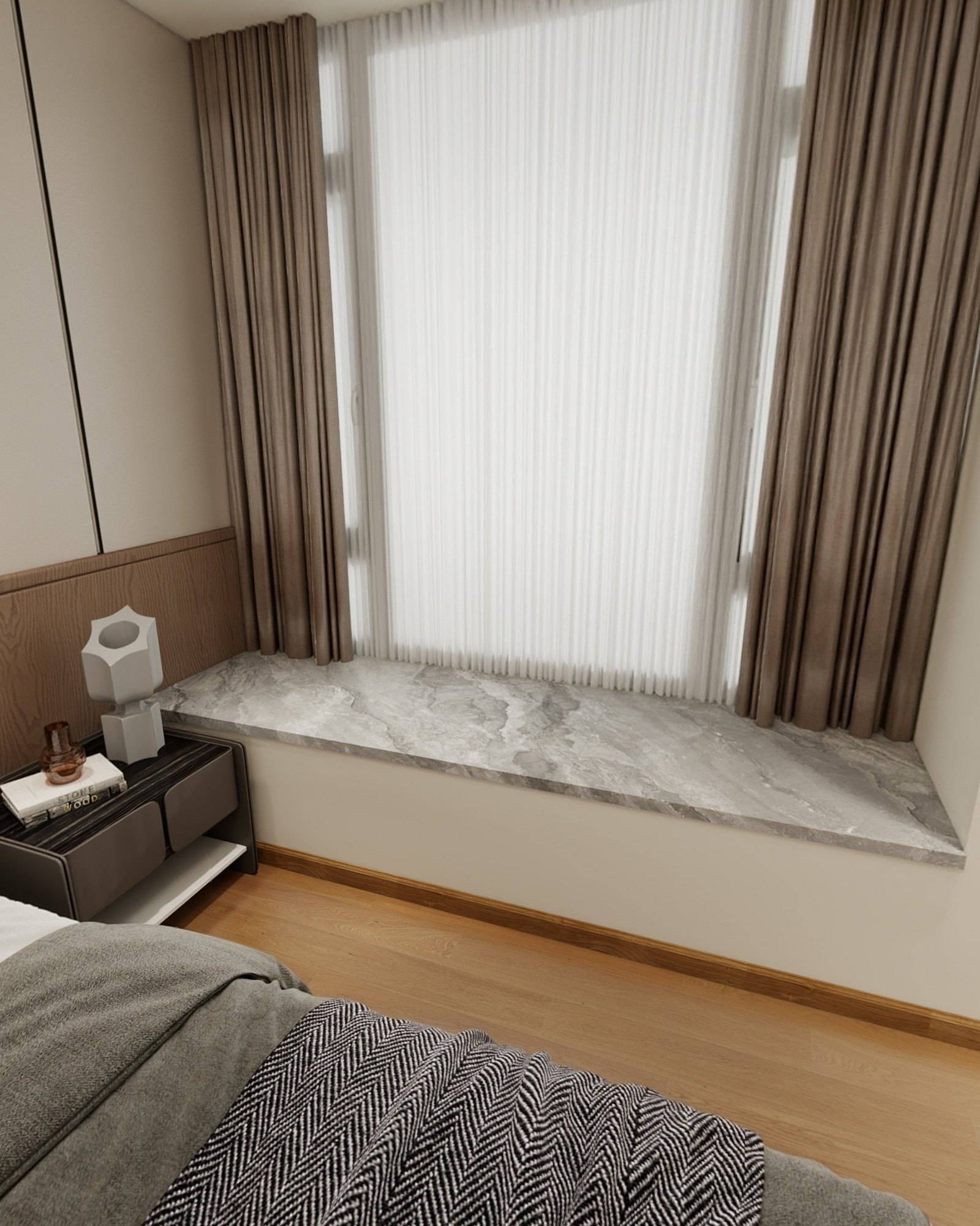 Stone window seat framed by sheer and bronze-toned curtains