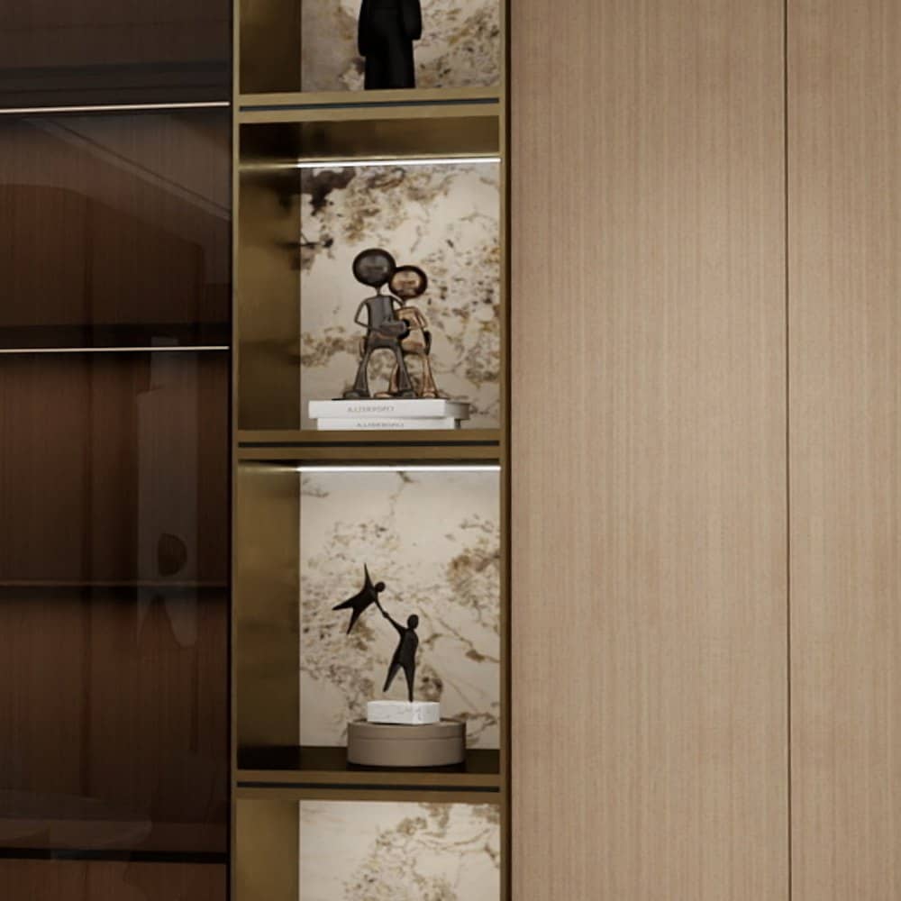 Close view of bronze-tone framing and dark glass on display cabinetry