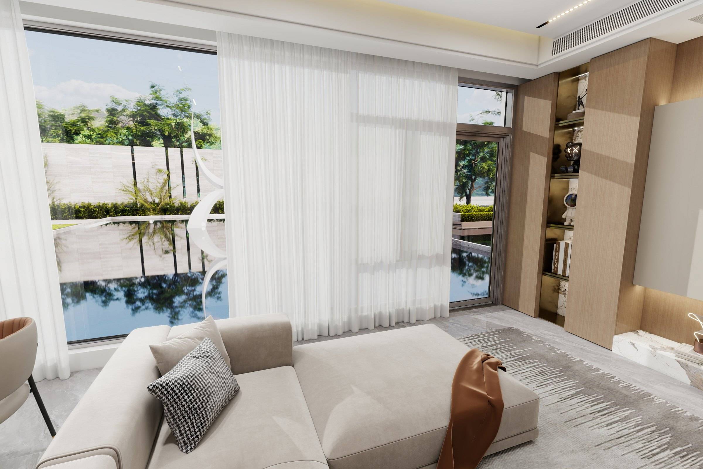 Living room with a low upholstered sofa, sheer curtains and full-height windows looking onto the garden