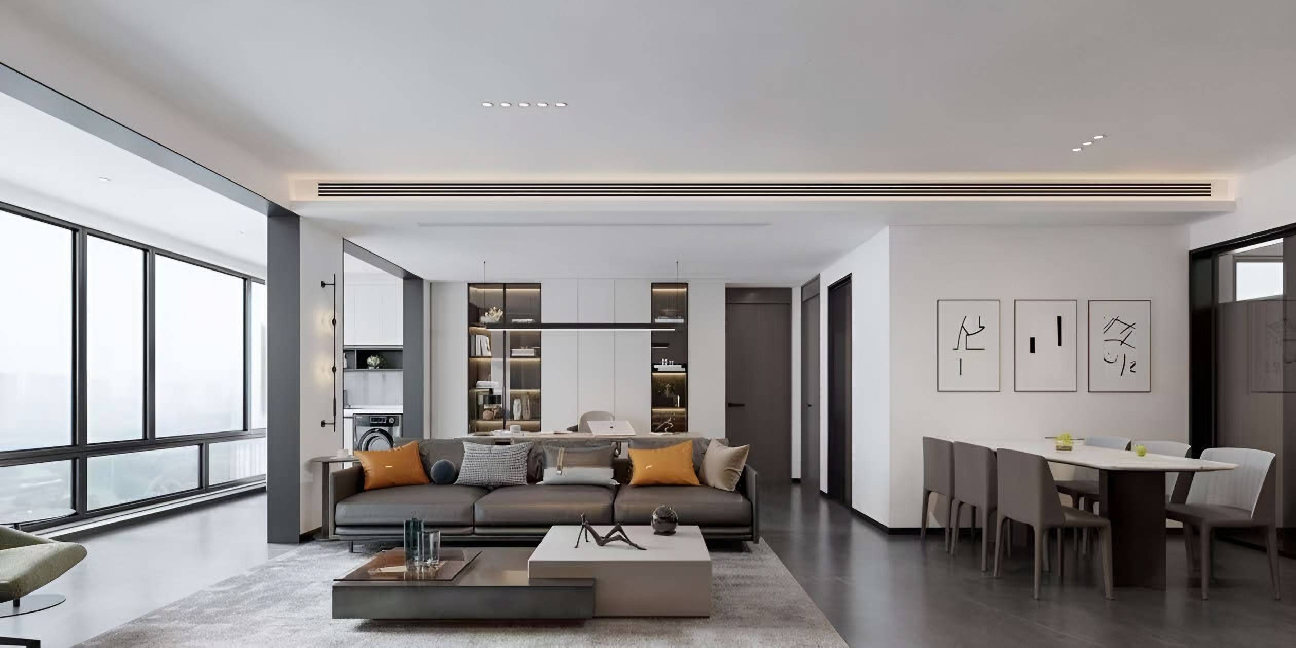 Apartment living and dining space with a grey sofa, low stone and timber tables, lit display cabinetry and full-height windows