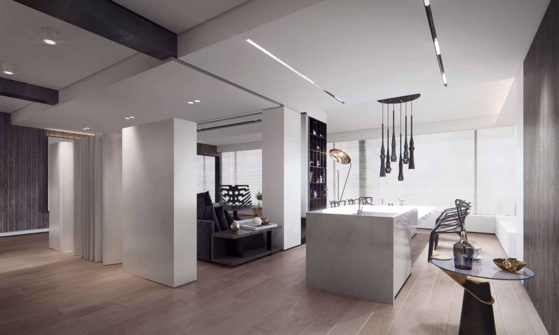 Open kitchen with a white stone island, clustered sculptural pendants and pale oak floors