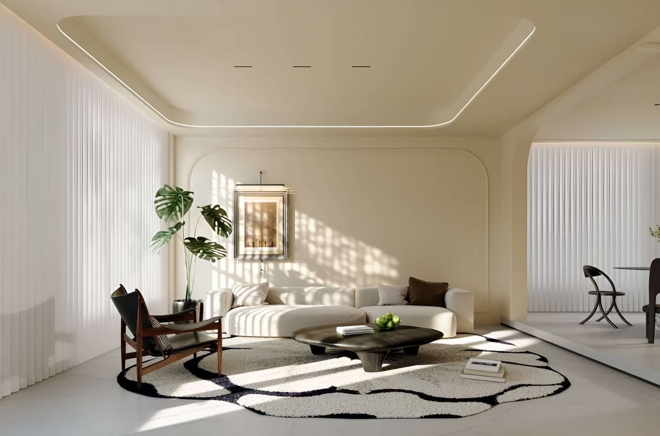 Ivory living room with a curved sofa, a sculptural rug, softly arched wall panels and sunlight through vertical blinds