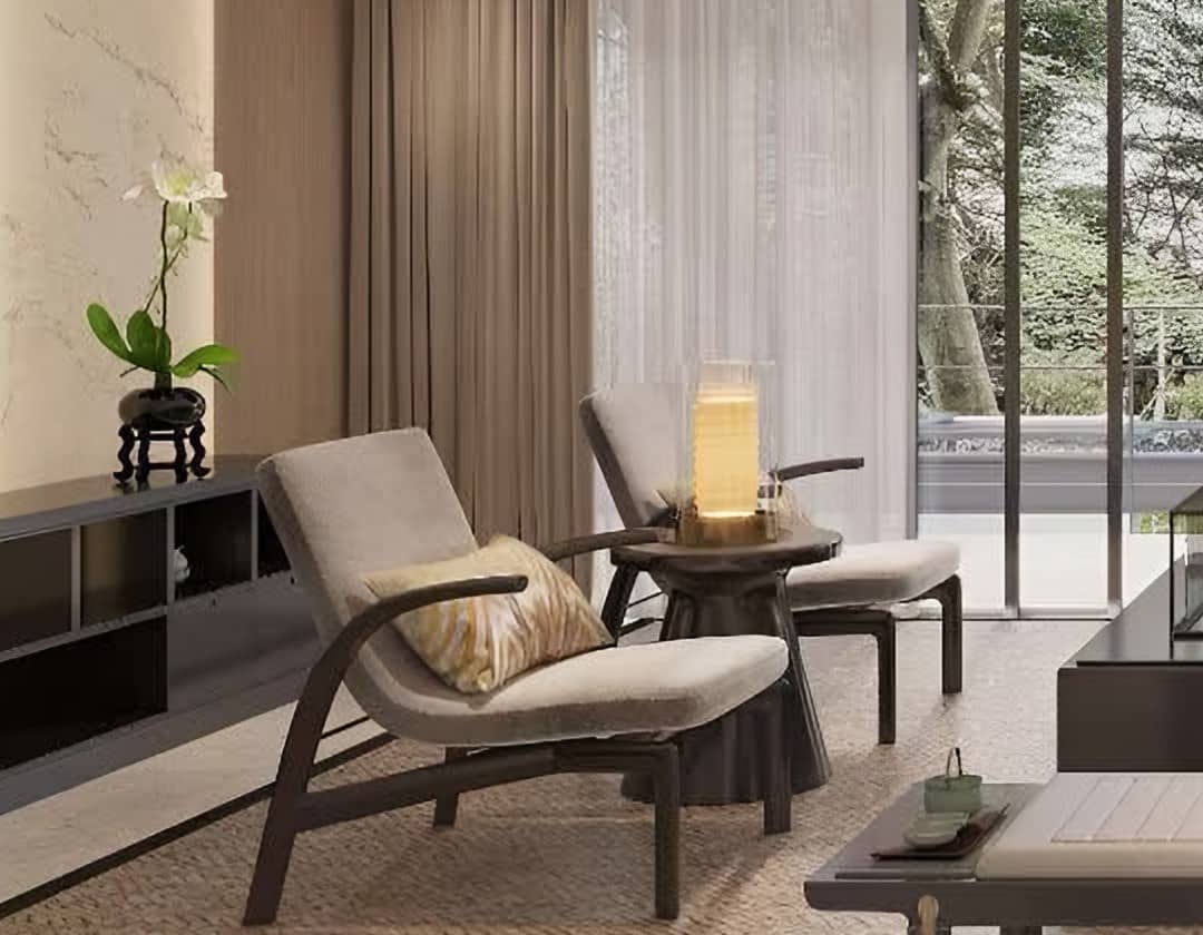 Timber-framed lounge chair and lantern lamp beside a woven rug