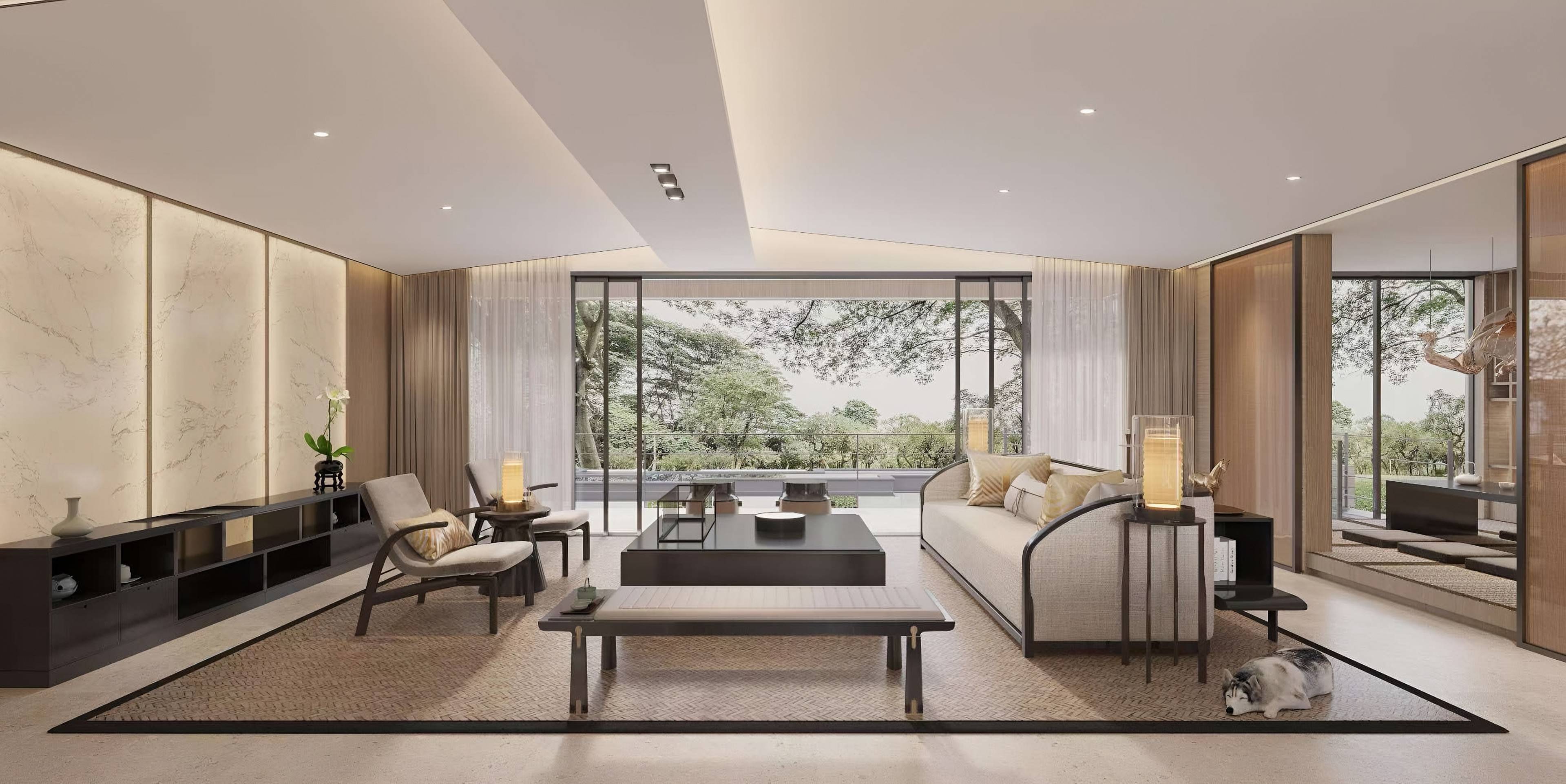 Living room opening onto woodland through full-height glazing, with backlit stone wall panels, a woven rug and low timber furniture