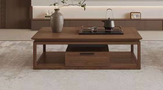 Walnut tea table with a drawer, set with a teapot and a branch in a stoneware vase