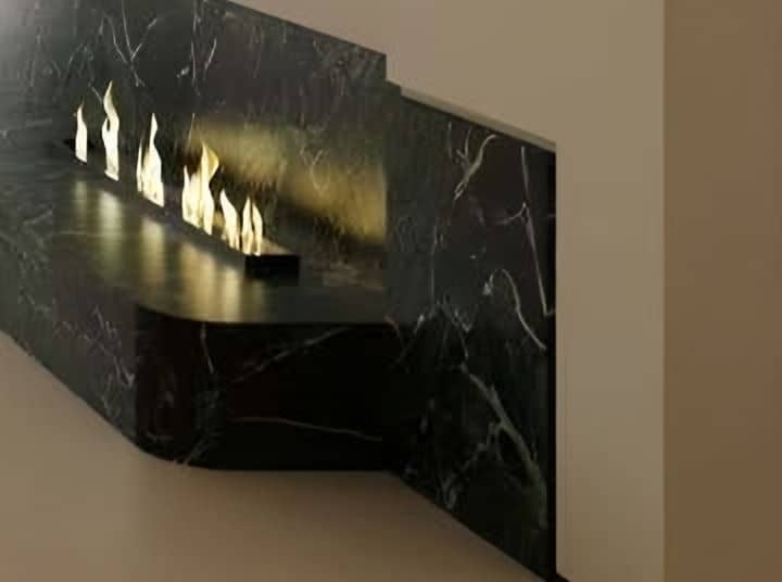 Black marble fireplace with a linear flame set into a white wall