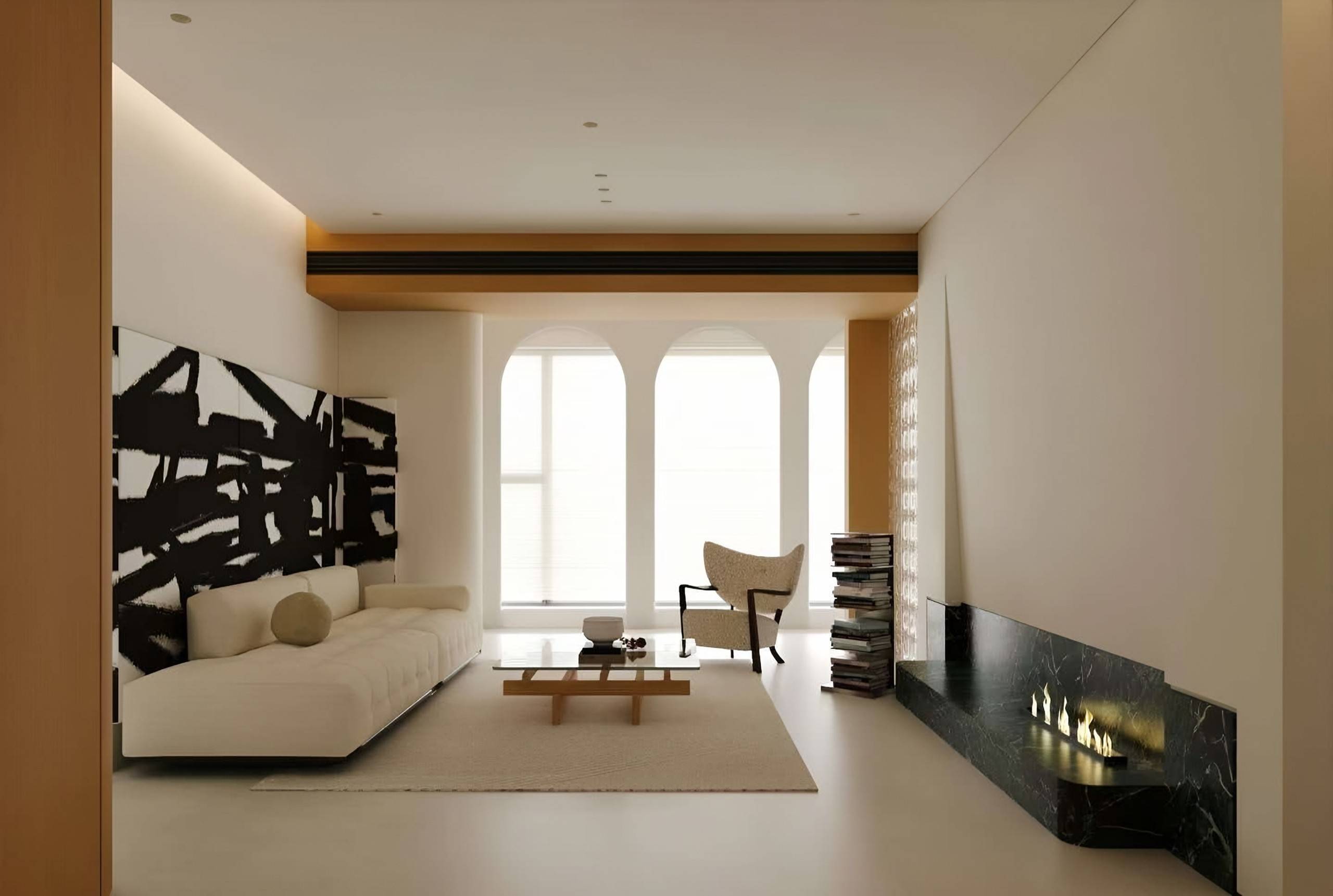 Ivory living room with arched windows, a large abstract artwork, a low sofa and a black marble fireplace