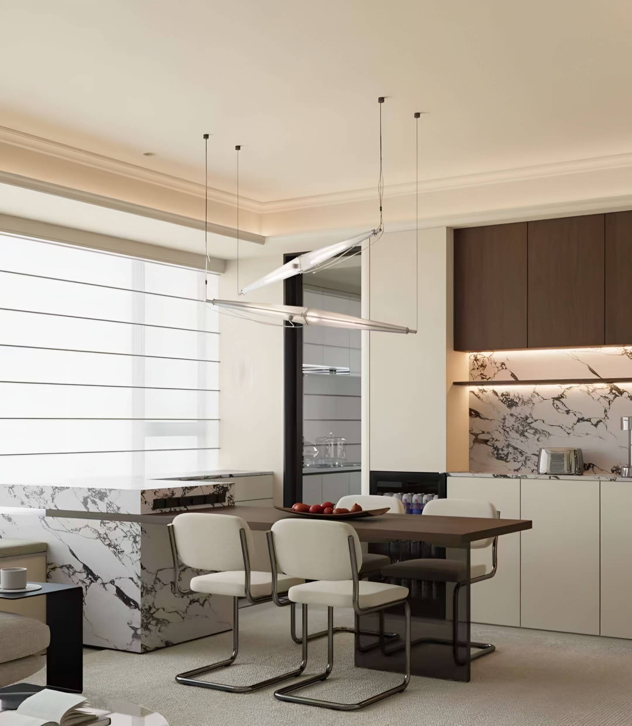 Kitchen run with a dramatically veined marble backsplash, dark timber upper cabinets and a stone dining counter