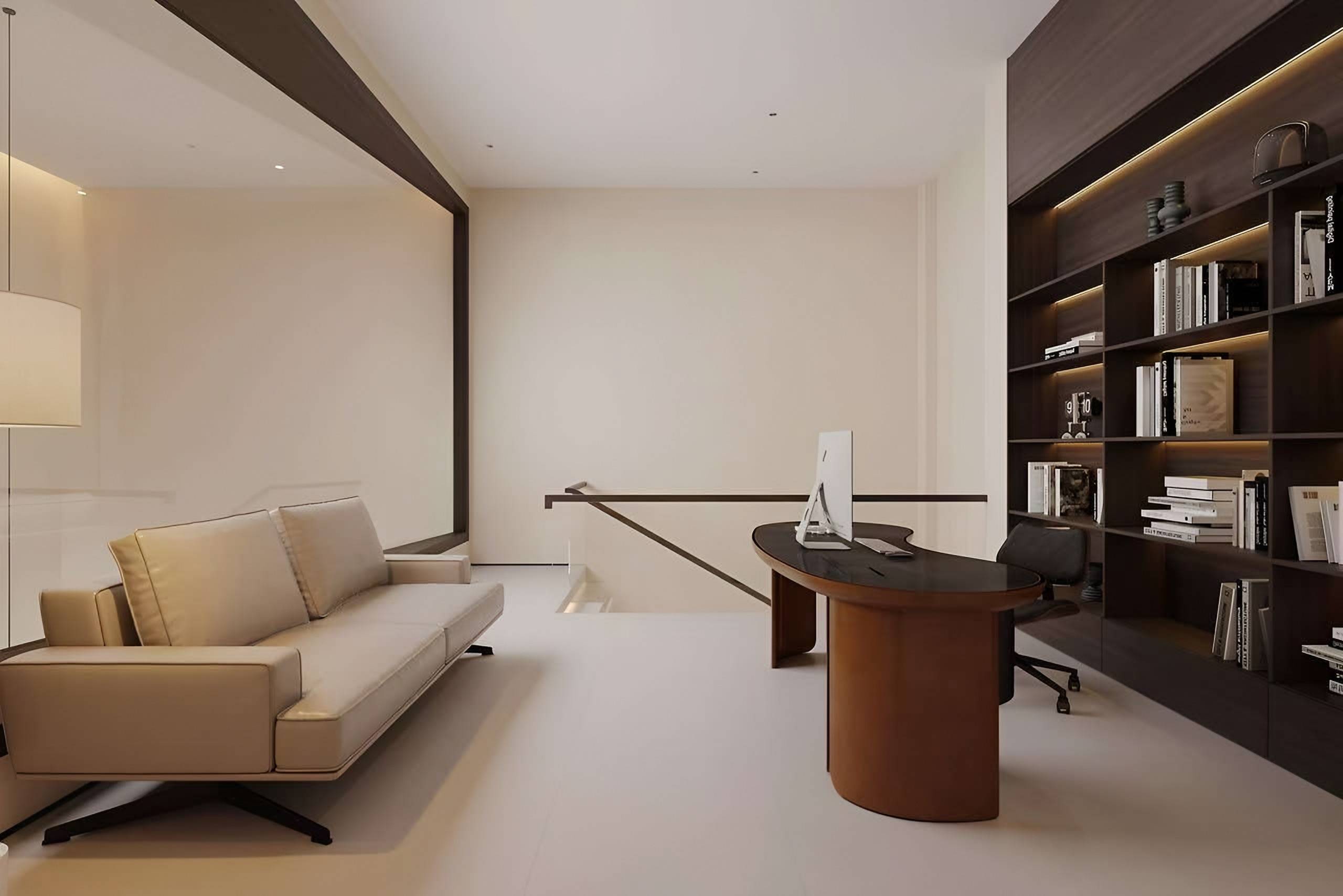Study with a leather sofa, a curved timber desk and dark timber shelving framed by a dark timber portal