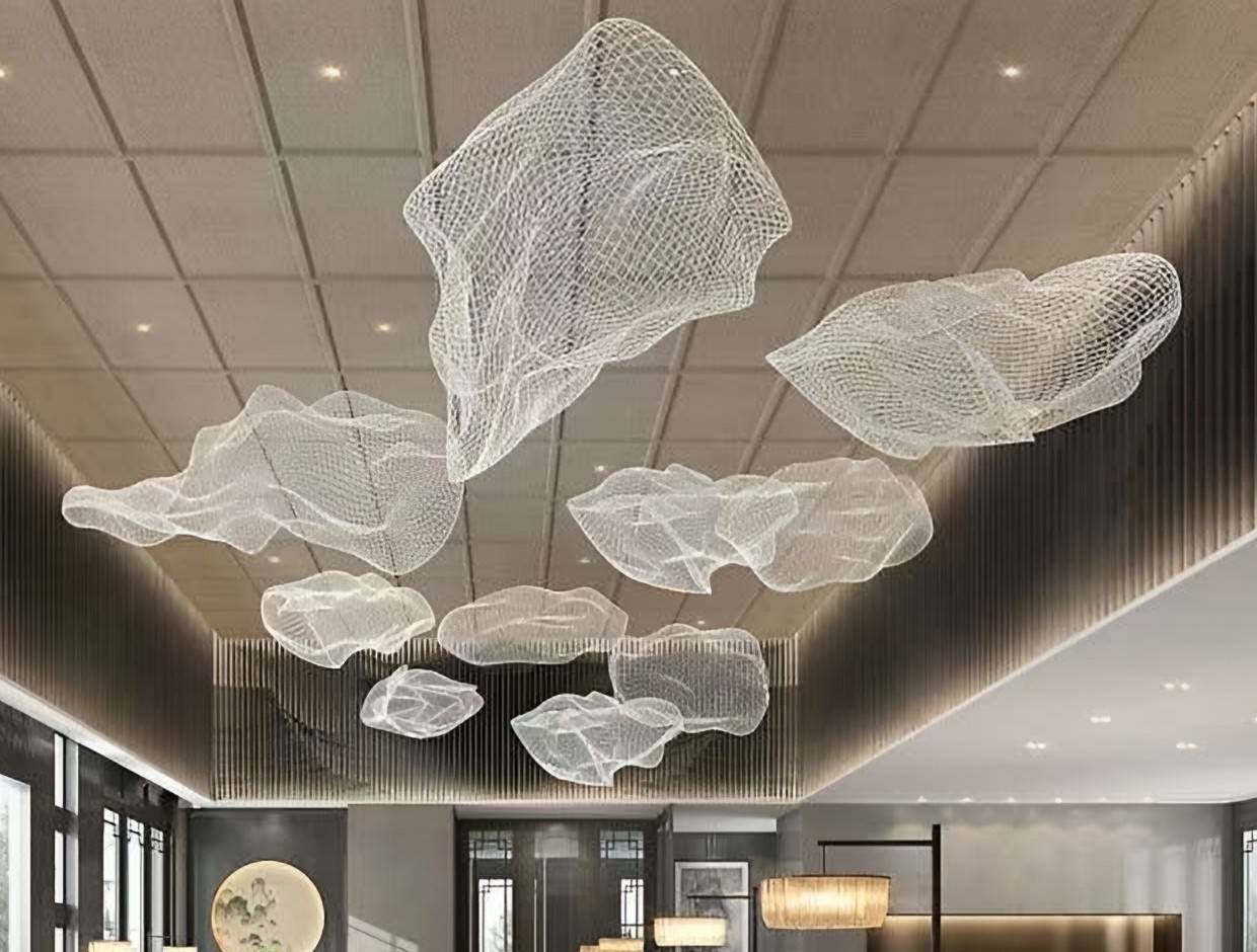 Suspended cloud-like mesh sculptures beneath a timber grid ceiling
